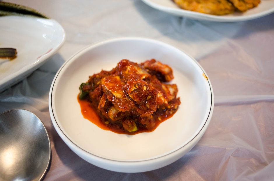 A vibrant bowl of traditional Korean kimchi, capturing the rich spices and colors.